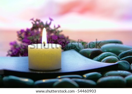 Meditation Candle Burning On A Wood Dish Over A Bed Of Stones With ...
