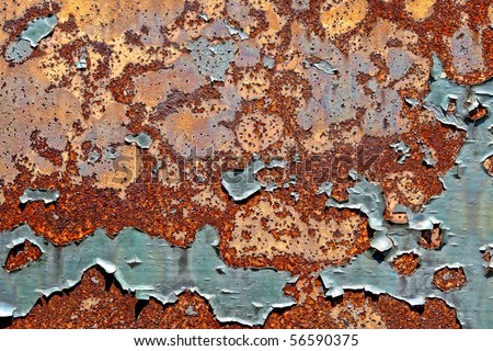 Grunge industrial background of old peeling paint on rough and rusty corroded metal surface
