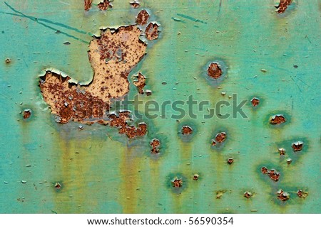 Grunge industrial background of old peeling paint on rough and rusty corroded metal surface