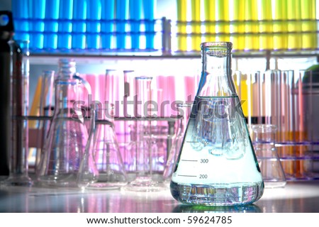 Laboratory glass conical Erlenmeyer flask filled with liquid for an experiment in a science research lab