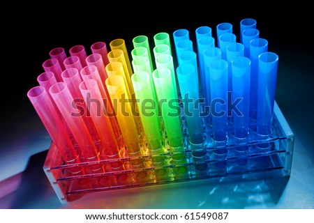 stock photo : Plastic test tubes in rainbow colors on a rack in a science 