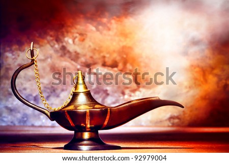 Antique artisanal Aladdin Arabian nights genie style oil lamp with soft light white smoke