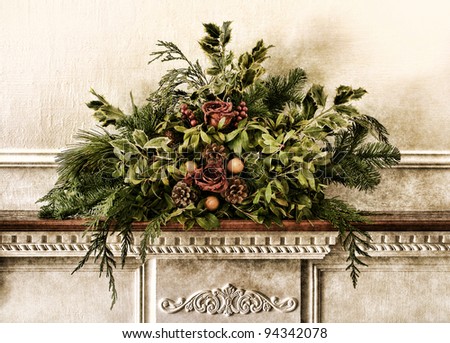 Grunge vintage Victorian Christmas floral arrangement decoration with roses and pine branches with green foliage on antique fireplace mantel in old historic home aged postcard style nostalgic colors