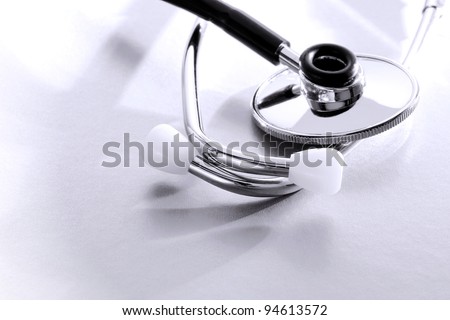 Medical doctor examination and heart pulse listening device stethoscope ear tubes tips and chest piece detail