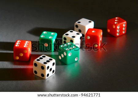 Casino gambling craps game dice used for shooting and rolling with bet wager on roll over reflective surface