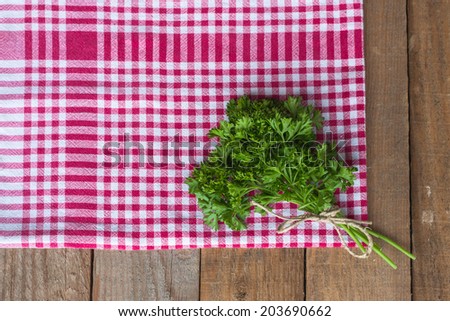 Parsley on a red kitchen rag
