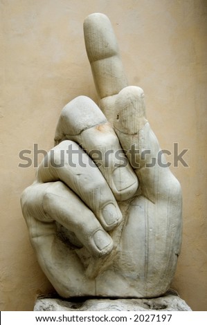 Giant hand with a pointing finger, part of Constantine\'s colossal statue, in the courtyard of Musei Capitolini in Rome, Italy.