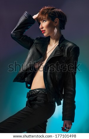 beautiful woman in sexy leather coat. Fashion photo.