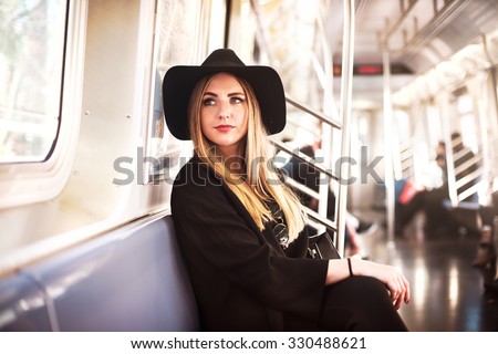 Elegant fashion business woman in the metro