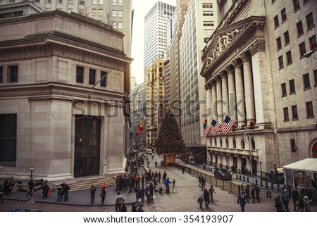 NEW YORK CITY - DECEMBER 15: Wall Street with New York Stock Exchange in Manhattan Finance district during Christmas, December 15, 2015 in Manhattan, New York City.