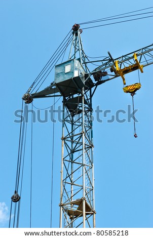 tall tower crane with a cabin