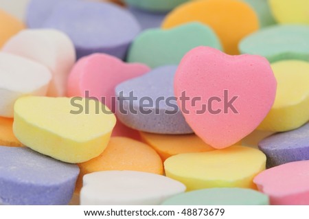Valentine\'s Day conversation hearts, with room for personalized text on the pink heart.