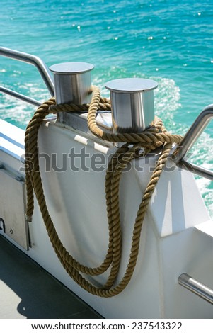bollard with coiled rope on board ship