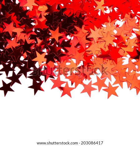 star shaped red confetti on white background. festive background