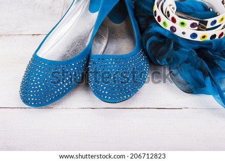 Pair of leather women shoes and belt