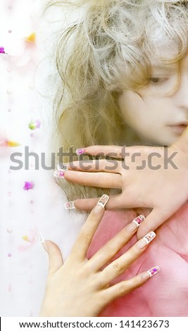 Beautiful mysterious girl with long nails and beads inside the nail.