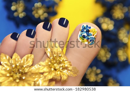 Blue pedicure with butterflies in white lacquer big toe with Golden flowers.