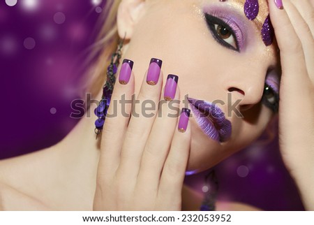 Purple French manicure and makeup on a young woman.