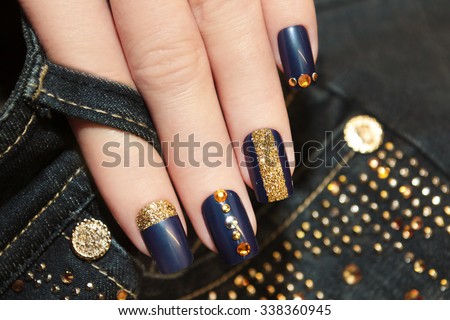 Denim blue manicure with rhinestones and sequins.