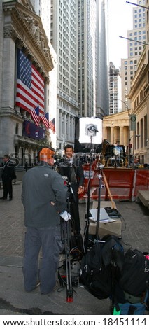 NEW YORK, NY -- SEPTEMBER 30, 2008: A Reporter Broadcasts Live outside the New York Stock Exchange on September 30, 2008, the day after the record-breaking 777-point drop in the Dow