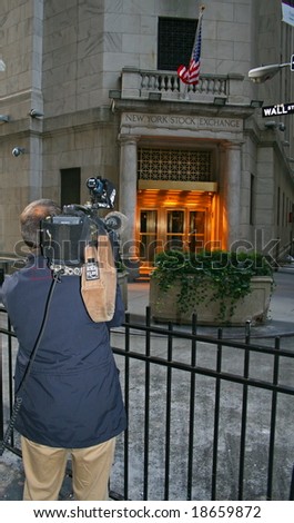 NEW YORK, NY -- OCTOBER 8, 2008: A television news reporter focuses on the New York Stock Exchange on October 8, 2008, the sixth straight down day of the crash of 2008