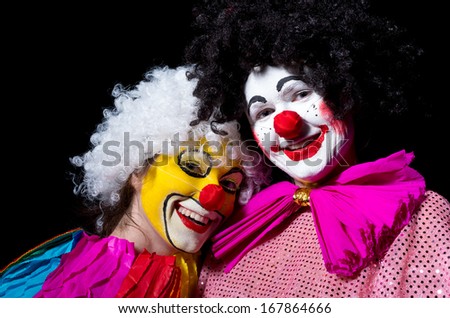 Two birthday clown\'s in the black background