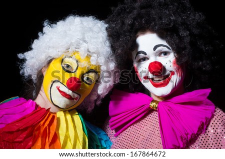 Two birthday clown\'s in the black background