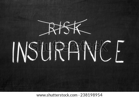 Insurance risk crossed out on the grey blackboard