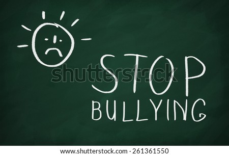 On the blackboard draw character and write Stop bullying
