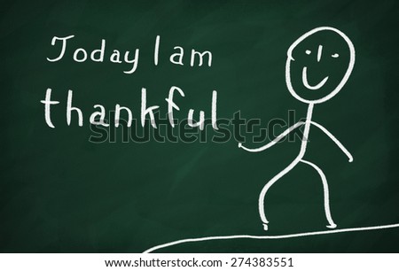 On the blackboard draw character and write Today I am thankful