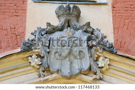 Carved stone coat of arms on the wall, Peterhof, Russia