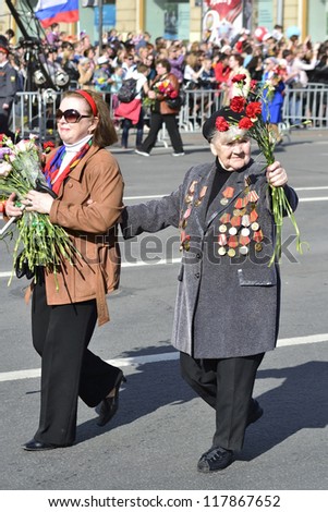 ST.PETERSBURG - MAY 9: Victory Day. Female veteran of World War II on Nevsky Prospekt. The parade of veterans in honor of 67 anniversary of the victory, May 9, 2012 in St.Petersburg, Russia.