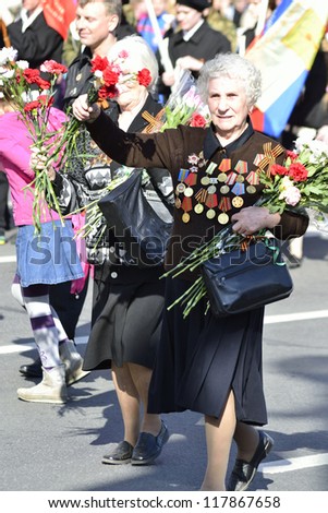 ST.PETERSBURG - MAY 9: Victory Day. Female veteran of World War II on Nevsky Prospekt. The parade of veterans in honor of 67 anniversary of the victory, May 9, 2012 in St.Petersburg, Russia.