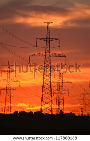 The photo of electric power transmission lines at sunset. Little noise