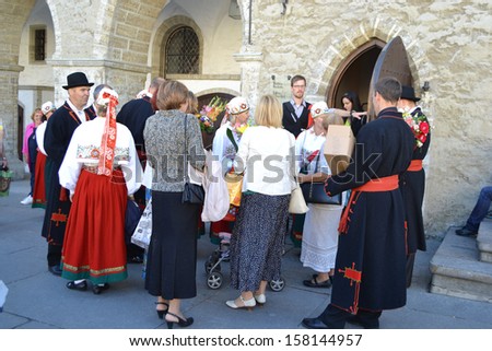 TALLINN, ESTONIA - SEPTEMBER 14: Several people in the Estonian national costumes in center of Tallinn, Estonia on September 14, 2013. Tallinn the capital and largest city of Estonia.