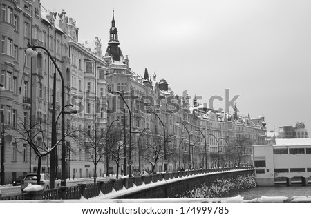 Embankment in center of Prague at winter, Czech Republic. Black and white.
