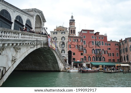 VENICE, ITALY - FEBRUARY 18, 2014: Rialto Bridge in center part of Venice, Italy.