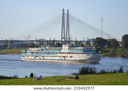 ST.PETERSBURG, RUSSIA - JULY 20, 2014: River cruise ship sailing on the river Neva, outskirts of St. Petersburg.