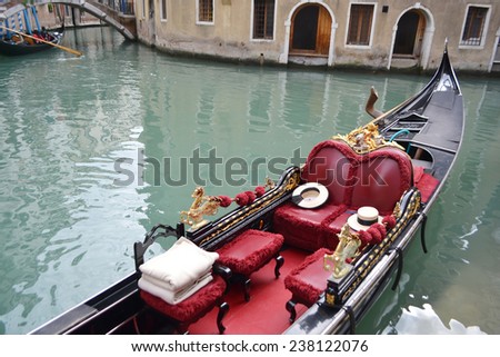 VENICE, ITALY - FEBRUARY 18, 2014: Gondola on canal in center of Venice, Italy.