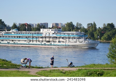 ST.PETERSBURG, RUSSIA - JULY 20, 2014: River cruise ship sailing on the river Neva, outskirts of St. Petersburg.