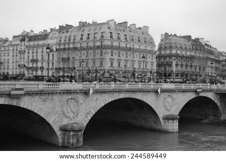 PARIS, FRANCE - JANUARY 6, 2013: Bridge Pont Neuf across the Seine in Paris, France. Black and white.