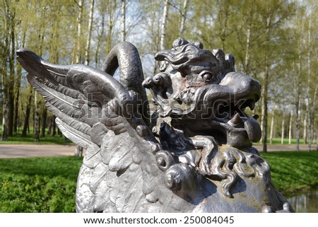 ST.PETERSBURG, RUSSIA - MAY 13, 2012: Metal Chinese Dragon Statue in Tsarskoye Selo, suburb of St. Petersburg.