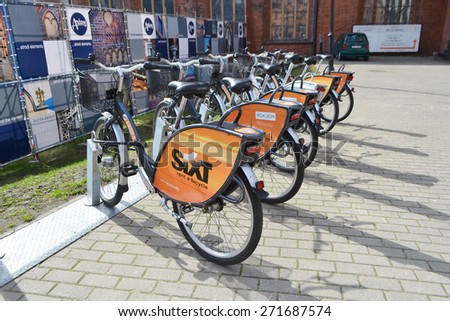 RIGA, LATVIA - APRIL 18, 2015: Parked bicycles in center of Riga. Bicycle rental.