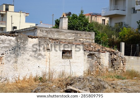 Old ruined uninhabited house in Loutraki, Greece.