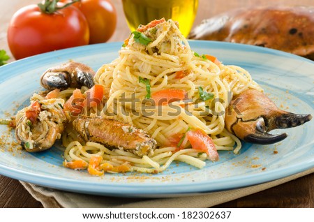 Spaghetti with crab, bottarga, fresh tomato and parsley, Italian Cuisine
