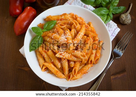 Penne with tomato sauce and parmigiano, italian cuisine