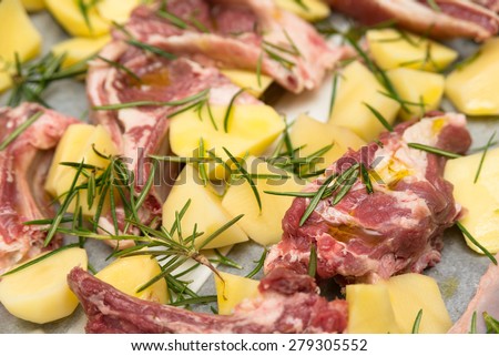Fresh lamb meat with potato and rosemary, Italian Food