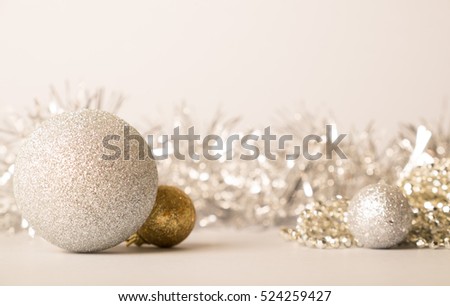 Big golden and small golden balls on golden background. Christmas and new year card