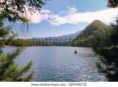Summer vacation on beautiful forest lake in Siberia