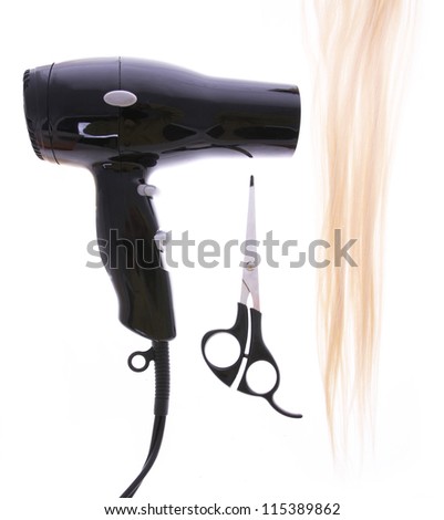 hair dryer, scissors and lock of hair isolated on white